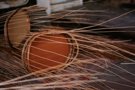 Unfinished wicker trays during weaving