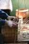 Unfinished wicker trays during weaving